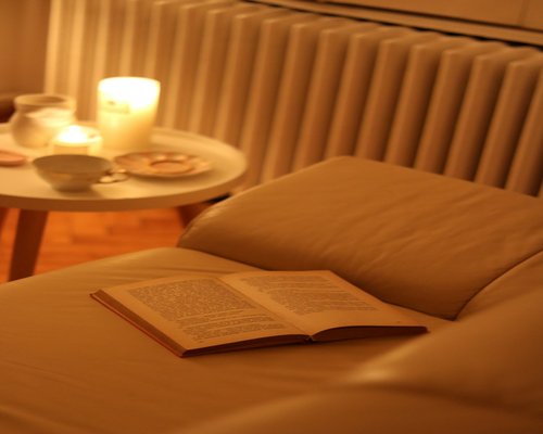 Cozy evening setting with a book and soft warm lamp light